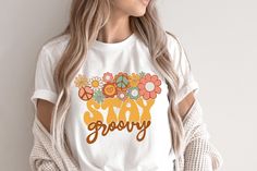 Very cute retro Stay groovy T-shirt! This will be perfect if you are looking for Hippie/boho style and great gift for family and friends! This classic unisex jersey short sleeve tee fits like a well-loved favorite. Soft cotton and quality print make users fall in love with it over and over again. These t-shirts have-ribbed knit collars to bolster shaping. The shoulders have taping for better fit over time. Dual side seams hold the garment's shape for longer.  .: 100% Airlume combed and ringspun Hippie Letter Print Tops For Spring, Spring Retro T-shirt With Retro Print, Vintage White T-shirt With Floral Print, White T-shirt With Retro Print For Spring, Hippie Tops With Funny Print For Spring, Hippie Top With Funny Print For Spring, Retro Cotton T-shirt With Floral Print, White Retro T-shirt With Floral Print, Spring Hippie Top With Funny Print