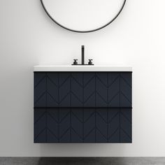 a bathroom vanity with a round mirror above it and a black cabinet underneath the sink