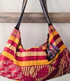 Sevya Kaftan Patchwork Crossbody Bag in Red and Yellow Print Bohemian Reversible Hobo Bag For Daily Use, Bohemian Reversible Shoulder Bag, Bohemian Upcycled Shoulder Bag For Daily Use, Bohemian Upcycled Tote Shoulder Bag, Bohemian Reversible Hobo Bag For Everyday Use, Bohemian Reversible Hobo Tote Bag, Bohemian Reversible Cotton Bag, Bohemian Cotton Shoulder Bag For Market, Bohemian Reversible Hobo Bag For Travel