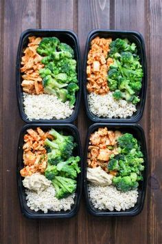 four plastic containers filled with rice and broccoli on top of a wooden table