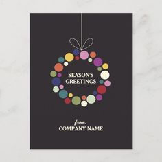 a christmas card with the words season's greetings and colorful balls on it