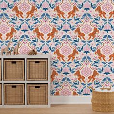 an orange and blue wallpaper with floral designs on the walls in a living room