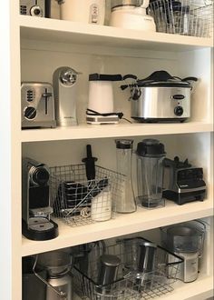 the shelves are full of kitchen appliances and cooking utensils