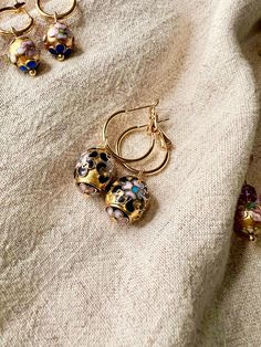 ✶ ✶ ✶ ~ Golden Belles collection ~ ✶ ✶ ✶  Vintage Chinese Champlevé cloisonné enamel earrings - oval gilt 1940s beads, 18k gold plated dangle hoop earrings, sustainable gift Stunning reworked earrings, using 1940s champlevé upcycled from a  vintage necklace, on new, 18k 18mm gold plated earring hoops - either 18mm larger hoops, or huggie hoops.  These have opulent royal vibes, with deep black, pink and blue enamel details.  Very limited edition.  Other cloisonné dangles available in my shop.  Pl Round Enamel Hoop Earrings As A Gift, Gold Round Hoop Earrings With Meenakari, Gold Earrings With Black Enamel For Gift, Black Enamel Hoop Earrings As Gift, Handmade Gold Enamel Earrings, Gold Enamel Hoop Earrings Gift, Gold Enamel Hoop Jewelry, Gold Enamel Drop Earrings, Gold Meenakari Hoop Earrings