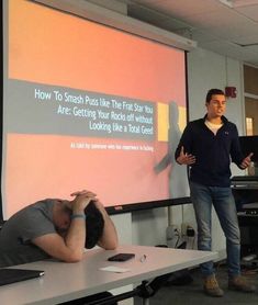 a man standing in front of a projection screen