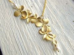 Bridesmaid Necklace, Gold Orchid Flowers with Freshwater Pearls, Bridal, Lariat Necklace, Wedding Jewelry by IrinSkye on Etsy https://www.etsy.com/listing/109863958/bridesmaid-necklace-gold-orchid-flowers Gold Bridesmaid Necklace, Gold Bridesmaid Jewelry, Orchid Necklace, Necklace With Pearls, Gold Orchid, Cascading Flowers, Pearls Wedding, Pearl Jewelry Wedding, Orchid Flowers