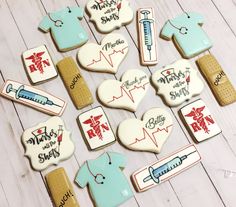 decorated cookies are arranged on a table with medical symbols and stethoscopes