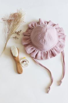 Keep your little ones stylish and protected with our Baby and Toddler Frill Sun Hat. Crafted from lightweight, breathable cotton muslin, this charming hat features a brim with delicate frills for added cuteness. The adjustable chin strap ensures a secure fit, while the breathable fabric offers excellent sun protection. Perfect for sunny days at the beach, park, or any outdoor adventure, this hat is a must-have for every baby's wardrobe. Available in a variety of adorable colours in sizes 0-3 mon Cotton Curved Brim Bonnet For Beach, Curved Brim Cotton Bonnet For Beach, Curved Brim Cotton Bonnet For The Beach, Cute Adjustable Cotton Sun Hat, Cute Adjustable Bonnet For Summer, Pink Cotton Summer Hat, Adjustable Cotton Bonnet For The Beach, Pink Summer Cotton Hat, Pink Cotton Sun Hat With Uv Protection