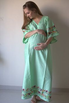 For maternity empire waist dresses are very flattering.A lot of customers sent me requests to make them empire waist kaftan. Instead of keeping the same style as my other kaftans and just raising the drawstring up, I thought of making a new pattern and made this one with butterfly sleeves and gave it an elastic waistline rather than a drawstring. I also added buttons in front on this one so that you can use it later for nursing as well.This will be very flattering on both small framed ladies as Nursing Friendly Maxi Maternity Dress, Maternity Nursing Friendly V-neck Maxi Dress, Nursing Friendly V-neck Maternity Maxi Dress, Green Short Sleeve Maternity Dress For Summer, Green Short Sleeve Maternity Dress, Nursing-friendly Maxi Maternity Dress, Green Maternity Maxi Dress, Green Summer Maternity Dress, Green V-neck Maternity Dress