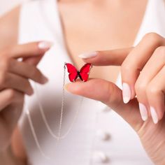 Red butterflies have long been associated with love and romance. In many cultures, the fluttering of a red butterfly's wings is believed to be a sign of a lover's promise. The color red is often seen as a symbol of desire and passion, making it the perfect color for a butterfly that represents love. • Material: High Quality Solid 925 Sterling Silver• Finish: Silver• It's dainty and can be worn every day• A special piece you'll treasure• High quality materials and attention to detail• Our jewelry Personalized Red Jewelry For Birthday Gift, Handmade Red Jewelry For Birthday Gift, Red Birthstone Jewelry For Her, Red Birthstone Jewelry Gift For Her, Red Birthstone Jewelry As A Gift For Her, Handmade Red Jewelry For Mother's Day, Red Sterling Silver Jewelry With Birthstone, Sterling Silver Jewelry With Red Birthstone, Red Sterling Silver Jewelry As Gift For Her