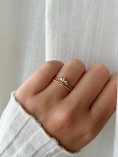 A gorgeous addition to your mix-and-match ring stacking collection! The Lis ring features a charming, emerald cut crystal on a twisted band. MATERIALS:   - Cubic zirconia  - 14k Gold/ Rose Gold (may contain copper) / Rhodium Plated, Brass   - Plating is 3 microns thick on Brass Follow us on INSTAGRAM @statementgrey Dainty Ring Stack, Match Ring, Gold Ring Stacking, Ring Crystal, Twisted Band, Etsy Gold Ring, Ring Stacking, Square Rings, Ring Minimalist