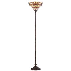 a floor lamp with an ornate glass shade on the top and bottom half of it