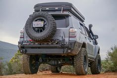 an off road vehicle is parked in the dirt