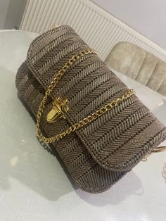 Dimensions: Width: 20 cm Height: 12 cm Width 5 cm Hanger Length 55 cm My multi-purpose bag, which I combined with a brown colored gold chain, is looking forward to meeting you. I have prepared a very easy product for you that you will enjoy in daily use or special occasions. In my product, our bag is knitted with paper rope, gold chain is used in the handle detail and cotton fabric is used in the inner lining. Summer Fashion Pouch Shoulder Bag, Beige Rectangular Shoulder Bag Fashion Accessory, Beige Shoulder Bag Fashion Accessory, Beige Rectangular Shoulder Bag, Rectangular Single Shoulder Strap Bag As Fashion Accessory, Rectangular Single Shoulder Strap Bag, Beige Mobile Phone Bag Fashion Accessory, Beige Mobile Phone Bag, Beige Clutch Shoulder Bag