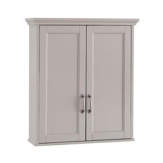 a white cabinet with two doors on it