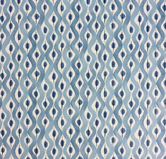 an abstract blue and white pattern on fabric