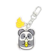 a keychain with a cartoon bear on it's face and a banana in its mouth