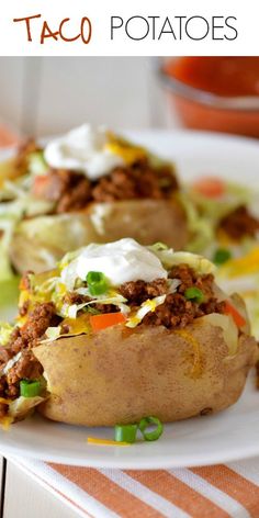 two loaded baked potatoes on a white plate with text overlay that reads taco potatoes