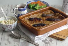 the meal is prepared and ready to be eaten on the wooden table with utensils