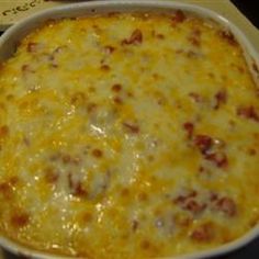 a casserole dish with cheese and meat in it