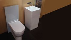 a white toilet sitting next to a tall pedestal sink