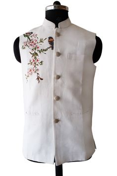 Hand painted Nehru jacket in pure linen fabric the motif is designed and painted by hand with very minute shading done.exclusive designer nehru jacket for your occassion to flaunt something new and very rare. jackets hand painted,rare designer nehru jackets We can also customize the colour we can do any personilization and make any design as you want White Sleeveless Cotton Nehru Jacket, White Cotton Nehru Jacket, White Embroidered Sleeveless Nehru Jacket, White Cotton Nehru Jacket With Floral Embroidery, Traditional White Nehru Jacket For Summer, Sleeveless Embroidered Cotton Nehru Jacket, Spring Embroidered Cotton Bandhgala, White Cotton Nehru Jacket With Stand Collar, White Sleeveless Nehru Jacket For Spring