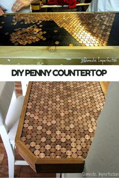 a wooden table topped with lots of gold coins next to a man working on a machine