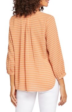 This lightweight crepe blouse has a roomy fit and a relaxed high-low hem, bringing wear-anywhere versatility to your wardrobe. 26" length (size Medium) Hidden-button placket Split neck Three-quarter sleeves with button cuffs Curved high-low hem 100% polyester Dry clean or machine wash, tumble dry Imported Orange Long Sleeve Blouse With Relaxed Fit, Orange Relaxed Fit Long Sleeve Blouse, Workwear Orange Top With Relaxed Fit, Orange Relaxed Fit Top For Work, Casual Orange Stretch Blouse, Casual Stretch Orange Blouse, Casual Orange Top With 3/4 Sleeves, Casual Orange Tops With 3/4 Sleeves, Casual Orange 3/4 Sleeve Top