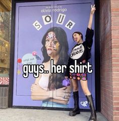 two women standing in front of a door with the words, guys her shirt on