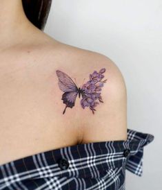 a woman with a butterfly tattoo on her shoulder