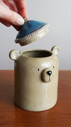 These ceramic bear pots are perfect for many things. You can use them as a flower pot/planter, to place your stationery items, or even to store candies. They can add a cute and fun detail to your house decoration.

They are made from stoneware and covered with a transparent and shiny glaze. The used materials are food safe. Animal Jar Ceramic, Bear Pottery Ceramics, Jar Ceramic Design, Cute Ceramic Pots, Lidded Pots Ceramics, Ceramic Jars With Lids Handmade, Home Made Ceramics, Ceramic Jar Ideas, Ceramics With Lids