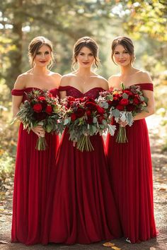 three bridesmaids in red dresses holding bouquets