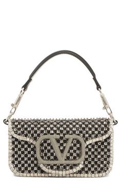 Starkly contrasting crystals and beads bring glam appeal to this leather shoulder bag that showcases a '90s-inspired silhouette and iconic VLOGO hardware. 6"W x 4"H x 2"D(interior capacity extra-small.) 5"strap drop; 23"crossbody strap drop 1.48lb Magnetic-snap flap closure Removable top carry handle; removable pull-through chain strap Interior wall pocket Structured silhouette with level base for stability Suede lining Leather Made in Italy Designer Handbags Luxury Beaded Shoulder Bag For Fashion, Luxury Beaded Shoulder Bag, Designer Leather Shoulder Bag With Rhinestones, Luxury Embellished Top Handle Shoulder Bag, Luxury Black Rhinestone Shoulder Bag, Luxury Shoulder Bag With Rhinestones And Top Handle, Luxury Rhinestone Shoulder Bag With Top Handle, Luxury Silver Shoulder Bag With Rhinestones, Glamorous Leather Embellished Bags