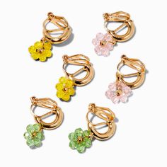 With no piercing needed, this clip-on hoop earrings set is the perfect finishing touch to your OOTD. The three pack has blush pink, green, and yellow beaded flowers. Pack Size: 3 pairFinish: Gold-toneSensitive Solutions Closure: Clip onMaterial: Plastic - Claire's Gold-tone Beaded Flowers Clip-On Hoop Earrings - 3 Pack Fun Clip On Earrings, Fun Clip, Crown Hair Clip, Sensitive Ears Earrings, Piercing Kit, Jewelry Words, Rainbow Cloud, Hair Accessories Gift, Fashionable Jewelry