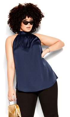 Sparkle all night long in the navy Sexy Shine Top. This gorgeous top comes in a navy blue shade that will make you stand out from the crowd. It features a high halter neckline, sleeveless design, and cute tie detail. The soft satin fabric is extremely comfortable to wear, and it's sleeveless cut makes it perfect for those hot summer nights. Key Features Include: - High halter neckline - Sleeveless - Relaxed fit - Tie neck detail - Soft satin fabrication - Unlined - Pull over style - Hip length S Chic Navy Party Top, Chic Navy Tops For Party, Chic Navy Top For Party, Elegant Navy Sleeveless Top, Halter Top Plus Size, Sparkly Heels, Plus Size Pants, Tops Online, Leather Trousers