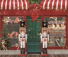 two nutcrackers are standing in front of a storefront with christmas decorations