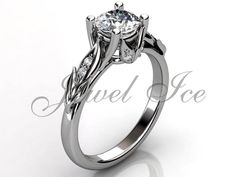 a white gold engagement ring with an intricate design