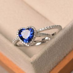 This ring features a 8 mm heart cut lab sapphire,and sterling silver finished with rhodium. Customization is available. It is made by hand, and it will take about 7 days to finish the ring after your payment is completed. Main stone: lab sapphire Main stone weight: Approx 2.59 ct Metal type: sterling silver finished with rhodium Accent stone: cz Customization is available, I also can make it with 14k solid gold (white or yellow or rose) and diamond accent stone, just feel free to contact me. Any Sapphire Ring Silver, Sapphire Diamond Wedding Band, Ring Silver Wedding, Sapphire Wedding Rings, Blue Sapphire Ring, Sapphire Wedding, Heart Shaped Rings, Silver Wedding Rings, Wedding Band Sets