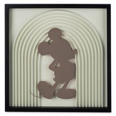 a shadow of mickey mouse in front of a white and black background with an arch