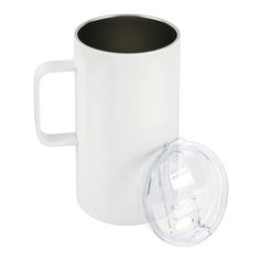 a white coffee mug with a lid next to a glass cup on a white background