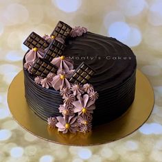 a chocolate cake decorated with flowers and crosses