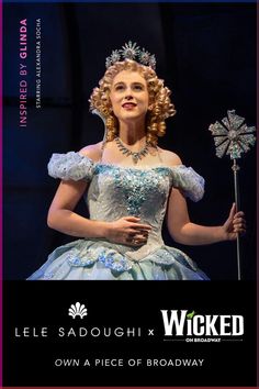 a woman in a blue dress holding a pinwheel with the caption, let's saugh & wickend own a piece of broadway