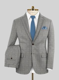 Immerse yourself in the seamless blend of opulence and fashion with our Loro Piana Niccolo Wool Suit. Expertly crafted from pure wool fabric and embellished with a sophisticated plaid pattern, the classy shade of gray not only harmonizes with the distinguished brown base but also introduces a subtle contrast that captures attention without being ostentatious. Whether destined for a wedding, a formal daytime affair, or simply as a refined addition to your personal style, this suit epitomizes sart Elegant Tweed Suits For Winter, Elegant Plaid Semi-formal Blazer, Elegant Plaid Blazer For Semi-formal Occasions, Elegant Semi-formal Plaid Blazer, Gray Wool Suit For Business Casual, Luxury Fitted Plaid Blazer, Elegant Tweed Business Suit, Elegant Gray Wool Suit, Timeless Gray Wool Suits