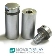 an image of two metal cylinders with screws on the top one is stainless steel