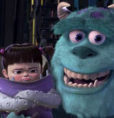 an animated character is standing next to a baby in a costume with big eyes and large teeth