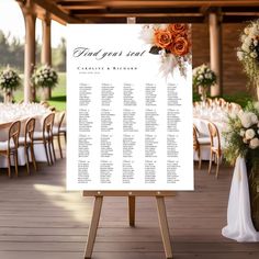 an outdoor wedding reception setup with seating chart