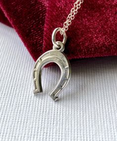 Neat little vintage horseshoe charm pendant necklace. Sterling silver, signed STER with makers initials on reverse.  Small size pendant measures just a smidge over 1/2" in size, with hanging loop it hangs down approx 3/4" from top to bottom. Horseshoe by itself measures approx 15 mm approx.  Chain measures 18" long, sterling silver, signed JCM 925 on clasp.  In very good used, vintage condition. Light normal surface wear, light patina. Pre-owned.  See you on Instagram @luxcharmjewelry xo - stop by often to see NEW arrivals Silver Horseshoe Charms Jewelry, Silver Horseshoe Necklace For Gift, Nickel-free Silver Horseshoe Necklace, Classic Horseshoe Jewelry As A Gift, Silver Horseshoe Necklace Nickel Free, Personalized Silver Horseshoe Jewelry, Sterling Silver Horseshoe Necklace For Gifts, Horseshoe Shaped Sterling Silver Necklaces, Silver Sterling Silver Horseshoe Necklace