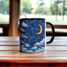 Embrace the enchanting allure of the night sky with our 11oz ceramic mug adorned with a captivating illustration of the moon and stars. Sip your favorite beverage while gazing upon this celestial masterpiece, perfect for igniting your imagination and adding a touch of cosmic wonder to your day. Ideal for stargazers and dreamers alike, this mug makes for a delightful addition to any collection and a thoughtful gift for those who find solace in the beauty of the universe. .: Material: 100% ceramic Galaxy Mug, The Moon And Stars, Astronomy Gift, Galaxy Theme, Cosmic Art, Star Coffee, Art Coffee, Ceramics Pottery Art, Night Painting