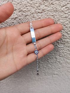 Color: silver Material: 925 solid silver Bracelet size: 16 cm 6 millimeter Evil eye size: 6 millimeter Name disk size : 2.8 cm 6mm note: If you want different size of bracelet, please contact me. 925 sterling solid silver bracelet has a very solid structure. I can engrave what you want on it. Evil eye detail on the side looks very elegant and beautiful. You will love this silver bracelet. https://www.etsy.com/shop/Hirajewelrydesign?ref=seller-platform-mcnav Personalized Blue Sterling Silver Bracelets, Silver Evil Eye Bracelets In Sterling Silver, Sterling Silver Evil Eye Bracelet In Silver, Sterling Silver Evil Eye Bracelets, Silver Hypoallergenic Evil Eye Bracelet Gift, Evil Eye Bracelet Silver, Silver Evil Eye Bracelet, Pro Nails, Solid Silver Bracelets