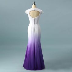 a dress on a mannequin with purple and white ombrettas in the back